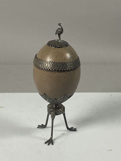 null Ostrich egg mounted in silver plated metal, standing on three legs in bird's...