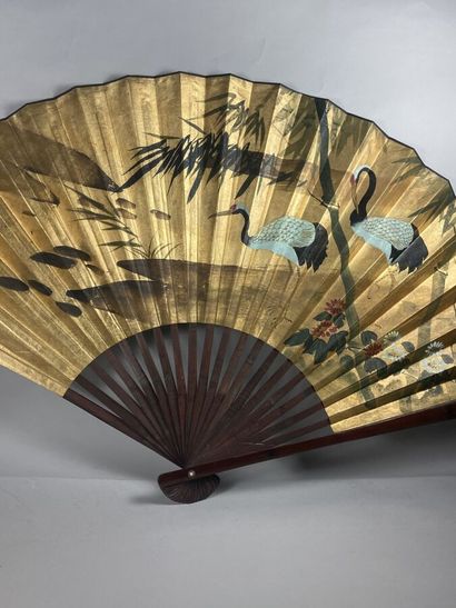 null Large wood and gilded paper fan representing cranes (symbol of longevity) and...