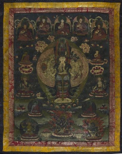 null THANGKA représentant un bodhisattva entouré de fleurs de lotus, le pourtour...