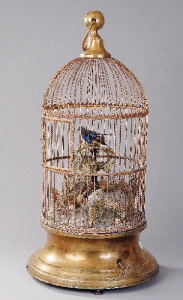 null Cage "à oiseau chanteur" en laiton, plâtre et carton, actionnée par une clé....