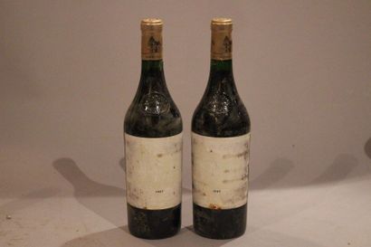 null 2 bouteilles CHATEAU HAUT BRION 1987 1er GCC Péssac Léognan (étiq abîmlées,...