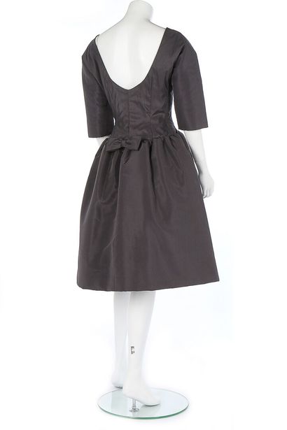 GIVENCHY A Givenchy black silk dinner dress, late 1950s,

A Givenchy couture black...