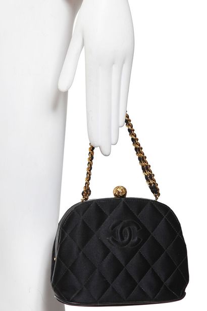 CHANEL A Chanel quilted black satin evening bag, mid 1990s

A Chanel quilted black...