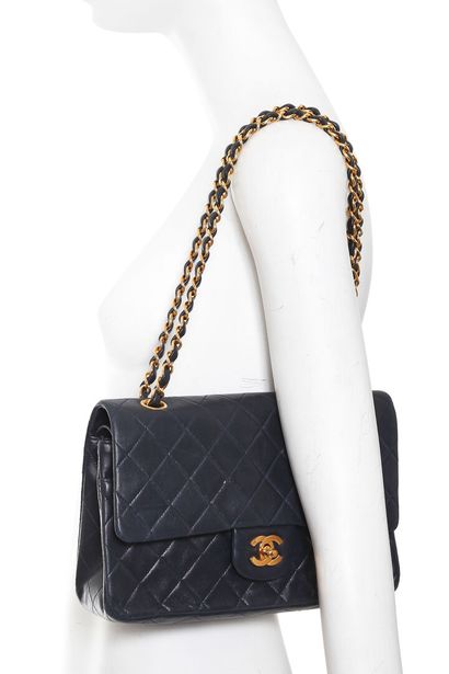 CHANEL A Chanel quilted navy lambskin leather re-issue double flap bag, 1994-96

A...