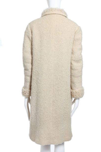 CHANEL A Chanel couture ivory bouclé-tweed and Mongolian lamb lined coat, 1960,

A...