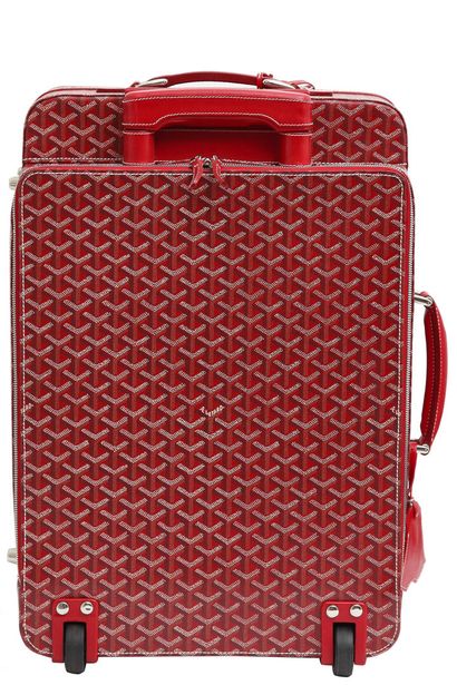 GOYARD A Goyard soft sided wheeled suitcase in red Goyardine leather, 1991,

A Goyard...