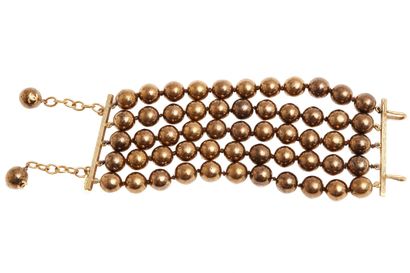 CHANEL Une demi-parure Chanel perles, 1984,

A Chanel bronze 'pearl' beaded demi-parure,...