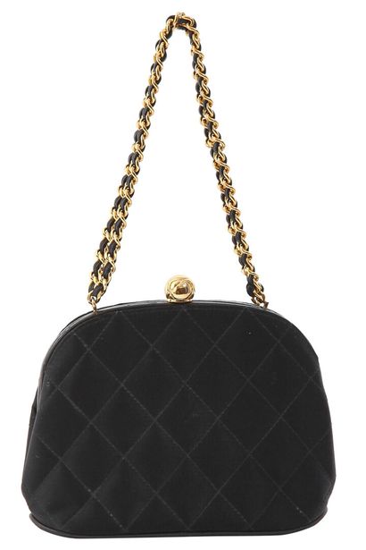 CHANEL A Chanel quilted black satin evening bag, mid 1990s

A Chanel quilted black...
