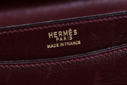HERMES A Hermes oxblood box leather Sandrine handbag, circa 1970,

An Hermès oxblood...