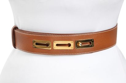 HERMES An Hermès reversible leather belt with gilt lizard buckle, 1997,

An Hermès...