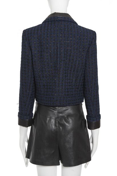 CHANEL Un ensemble Chanel en tweed et cuir, vers 2005,

A Chanel tweed and leather...