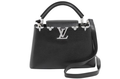 LOUIS VUITTON Un sac Louis Vuitton Capucine en cuir noir, moderne,

A Louis Vuitton...