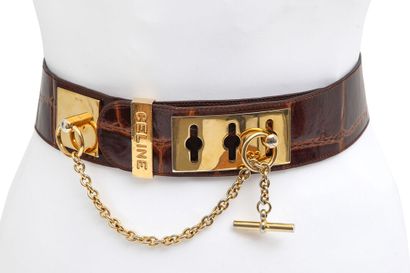CELINE Une ceinture en cuir marron Celine ornée de pièces d'Europe, années 1990,

A...