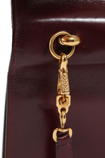 HERMES A Hermes oxblood box leather Sandrine handbag, circa 1970,

An Hermès oxblood...