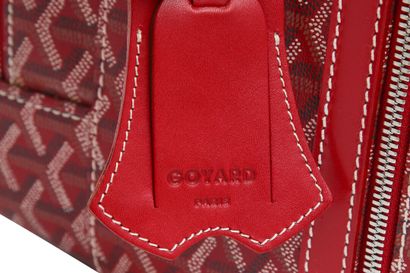 GOYARD Une valise souple à roulettes Goyard en cuir Goyardine rouge, 1991,

A Goyard...