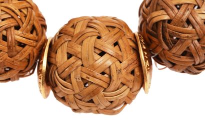 CHANEL 
A rare Chanel cherrywood basket-weave bauble necklace, 1999,





A rare...