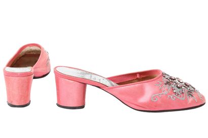 DIOR A pair of Christian Dior rose-pink satin mules, circa 1960

A pair of Christian...