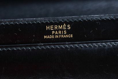 HERMES An Hermes black box leather handbag with gold scissor clasp, circa 1970

An...