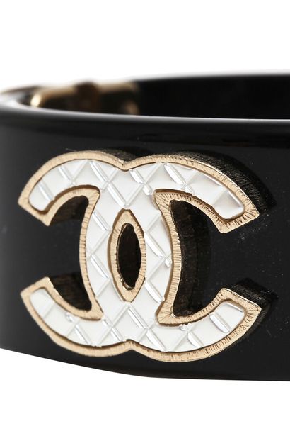CHANEL A pair of Chanel black resin cuffs, modern

A pair of Chanel black resin cuffs,...