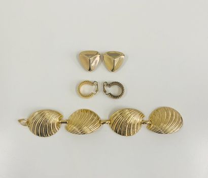 CHRISTIAN DIOR Year 1980 

Lot including a gilded metal bracelet with four articulated...