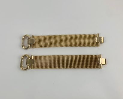 CHRISTIAN DIOR 1980's 

Pair of flexible cuff bracelets in gold-plated metal

Marked...