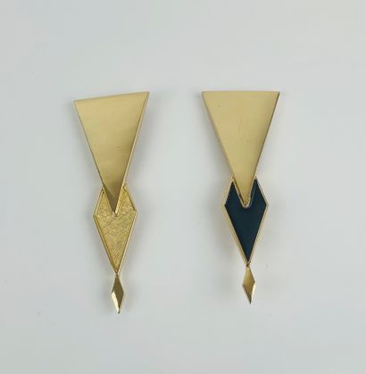 CHRISTIAN DIOR 1980's 

Two modernist style brooches in gilded metal, one partially...