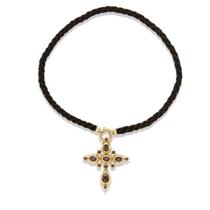 null Badine cross in 18K gold and garnets 

In 18K (750) gold set with garnets, French...