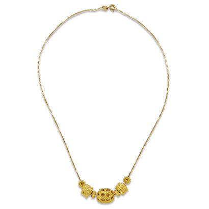 null Gold necklace 

The chain in 18K (750) gold with cubic links holding seven charms...