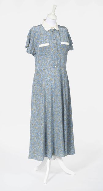 CELINE Silk long dress with claudine collar

decorated with flowers on a blue background,...