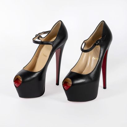 Christian LOUBOUTIN Pair of open toe wedge pumps Daffodile model

In black leather

Size...