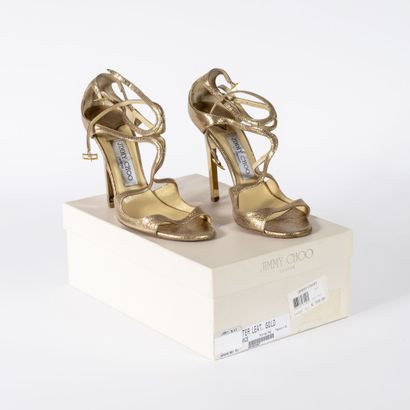 Jimmy CHOO Pair of gold leather heeled sandals 



Size 36,5



Box