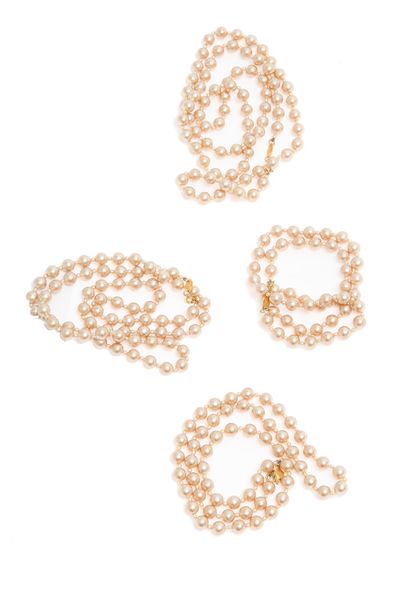 CHANEL Quatre colliers de perles imitation, 1983

signed, each a different length...