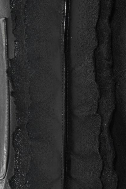 CHANEL Veste en cuir noir, circa 2013

labelled, size 46, with burnt-effect edges,...