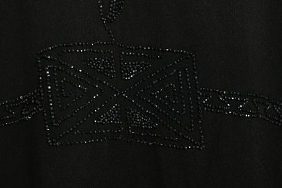 null Black beaded crepe evening coat, 1920s



embellished with cut-beads in foliate...