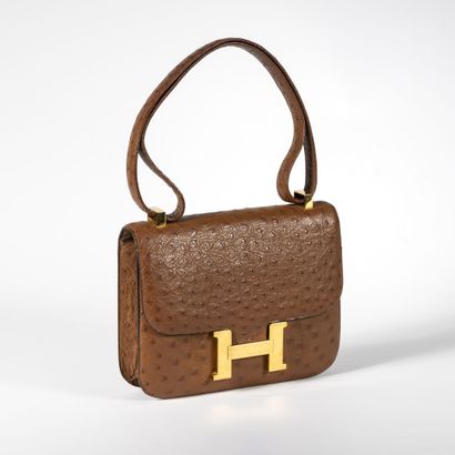 HERMES Constance 23 bag, 1972,

signed, blind stamp B, in dark brown ostrich leather...