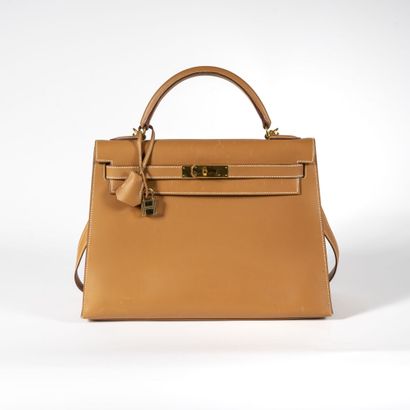 HERMES Kelly Sellier Bag 32, 2000,

signed, blind stamp D, in tan box calf leather...