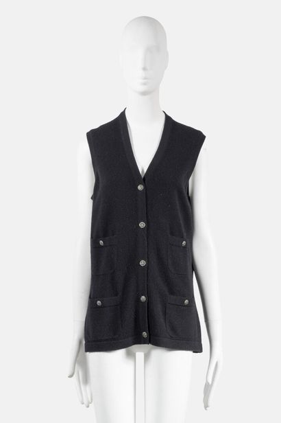 CHANEL Black cashmere sleeveless V-neck cardigan with four patch pockets and signature...