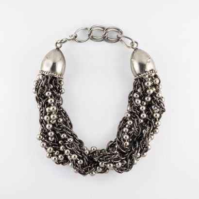 ATTRIBUE A YVES SAINT LAURENT Silver plated metal necklace made of a twist of chains...