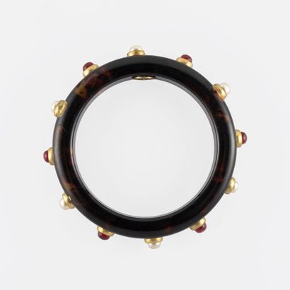 CHANEL Bracelet in resin imitating tortoiseshell decorated with cabochons of pearls...