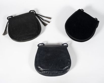 YVES SAINT LAURENT Three small bags in suede, leather and black and navy blue velvet,...