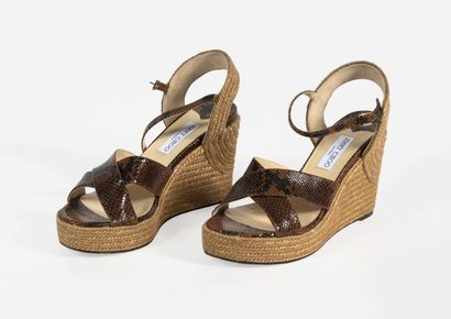 JIMMY CHOO Pair of brown imitation leather and rope wedge sandals
Size 41

Very good...