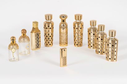 GUERLAIN A set of eight perfume bottles by Guerlain 
Two gilded metal bottle covers...