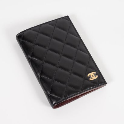 CHANEL Black quilted leather passport holder with brown leather interior
14.5 x 11...