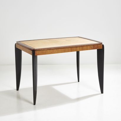 JULES LELEU (1883-1961) JULES LELEU (1883-1961)

A table with reversible beech top,...