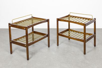 ISA ISA

A set of two suitcase holders, 1950s, stained walnut frame, brass rods.

A...