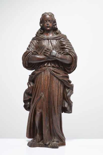 STATUE EN CHÊNE, VERS 1700 Statue en chêne. Saint personnage en pied au large drapé,...