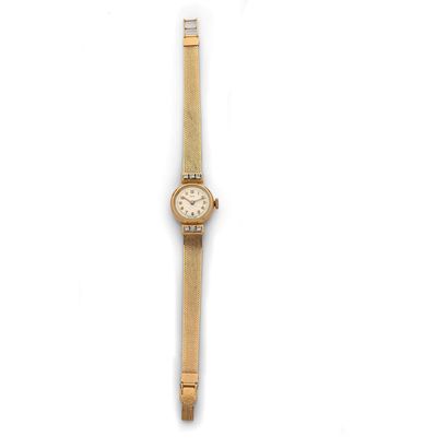 ERY ERY
Lady's watch in gold 18K (750 thousandths), circa 1950, silvered dial, Arabic...