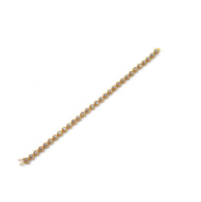 AYA AYA 
A line bracelet in 18K gold set with a series of round faceted cordierites...