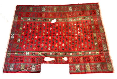 null RUGS OF THE EAST 

Kilim carpet, gray and green tones on a vermilion red background....