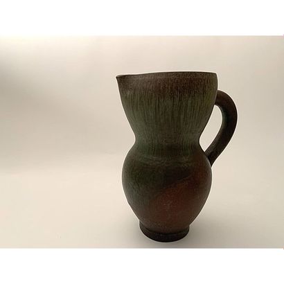 MADOURA MADOURA
Earthenware baluster pitcher, metallic green enamel on brown background....